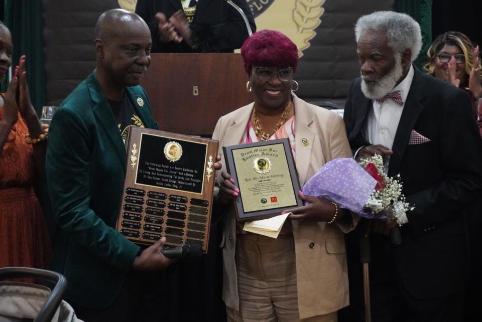 Rodney Long, left, MLK Commission of Florida Inc.’s president, stands beside 2024 Drum Major for Justice Faith Award Recipient the Rev. Marie Herring, center, and her husband, Lenton "Pop" Herring, right, during the annual Martin Luther King, Jr. Prayer Breakfast, held March 29 at the Best Western Gateway Grande Hotel, 4200 NW 97th Blvd., Gainesville.