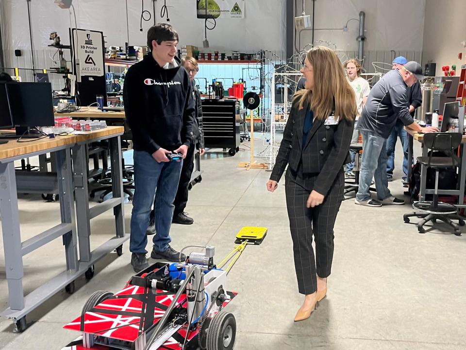 Tiffany Sanderson (right), president of Lake Area Technical College, speaks with a student in the Robotics Lab on campus March 10, 2023.