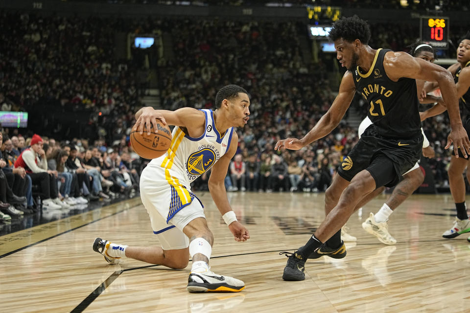 Dec 18, 2022; Toronto, Ontario, CAN; Golden State Warriors guard Jordan Poole (3) tries to trouble around Toronto Raptors forward <a class="link " href="https://sports.yahoo.com/nba/players/4290" data-i13n="sec:content-canvas;subsec:anchor_text;elm:context_link" data-ylk="slk:Thaddeus Young;sec:content-canvas;subsec:anchor_text;elm:context_link;itc:0">Thaddeus Young</a> (21) during the first half at Scotiabank Arena. Mandatory Credit: John E. Sokolowski-USA TODAY Sports
