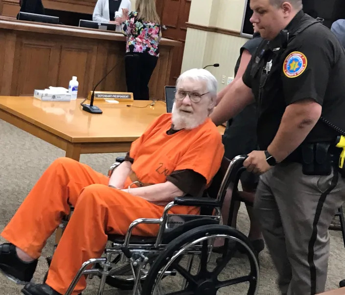Richard G. Pierce is escorted out of Door County Circuit Court on Friday, after he was sentenced to life in prison for the 1975 murder of his wife, Carol Jean Pierce. Richard Pierce also received a three-year sentence for moving the body after the murder.