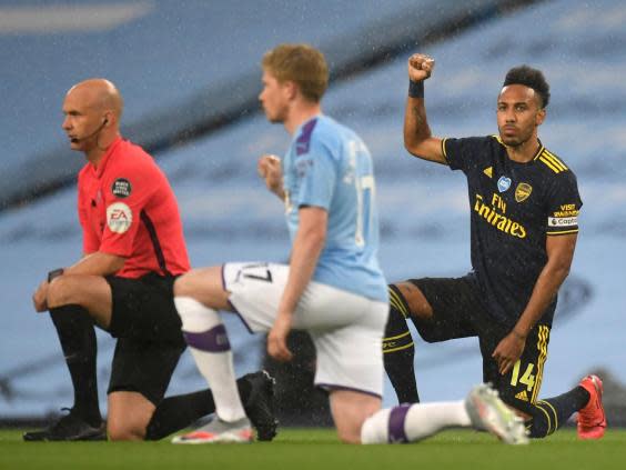 Players take a knee at the Etihad to show solidarity with the Black Lives Matter movement (Getty)