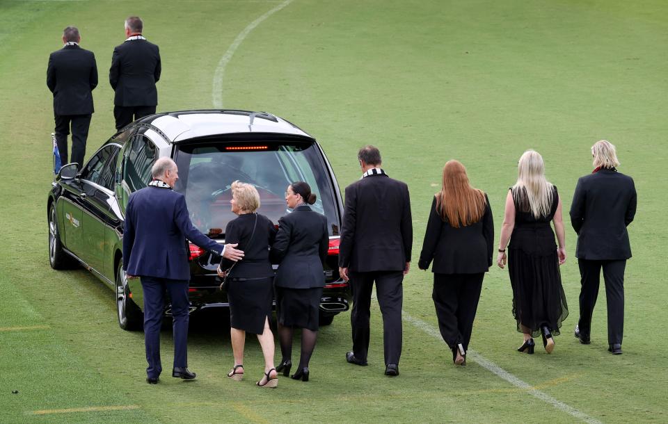 Shane Warne's family, pictured here following the hearse on a lap of the ground.