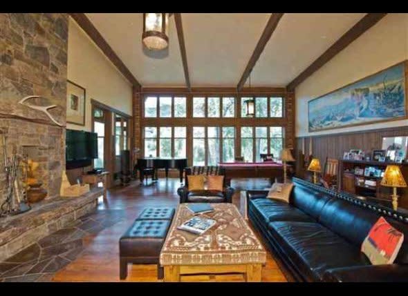 We love the mix of modern furnishing and rustic touches, like the exposed stone fireplace and floors, in this living room. Care to guess which actor, a famous rom-com heartthrob with a skill for portraying baseball players, lives here? Click <a href="http://www.stylelist.com/2011/10/25/dennis-quaids-montana-ranch_n_1032246.html#s433633" target="_hplink">here</a> for the answer.     Photo from AOL Real Estate.
