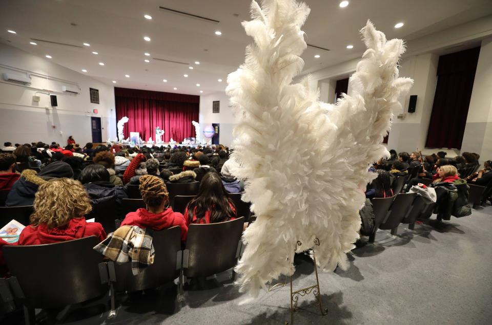 Wings made from feathers were placed in the auditorium during a memorial for teacher Ornela Morgan and her sons, Gabriel, 12 and Liam, 10, at the One World Middle School in the Bronx, Feb. 2, 2024.