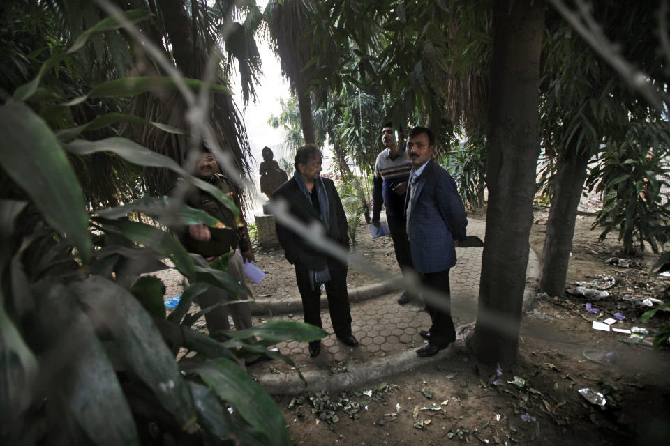 Indian investigators visit a spot which police say is where a Danish tourist was gang-raped in New Delhi, India, Wednesday, Jan. 15, 2014. A 51-year-old Danish tourist who lost her way and asked for directions back to her hotel was gang-raped Tuesday near a popular central shopping area in the Indian capital, police said Wednesday. The woman managed to reach her hotel Tuesday evening and the owner called police. The attack is the latest case to focus international attention on the scourge of rape and violence against women in India. (AP Photo/Altaf Qadri)