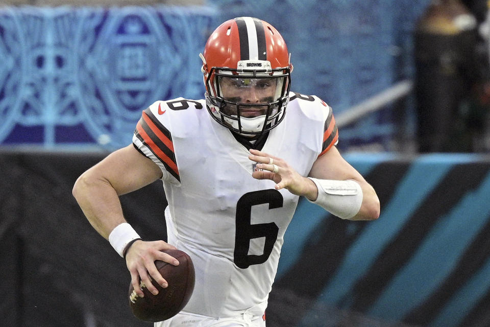 Cleveland Browns quarterback Baker Mayfield (6) scrambles for yardage during the second half of an NFL football game against the Jacksonville Jaguars, Sunday, Nov. 29, 2020, in Jacksonville, Fla. Mayfield made some head-scratching, jaw-dropping mistakes Sunday in Jacksonville, turning what should have been a fairly routine win for the Browns into a nail-biter. But despite his errors, Mayfield didn't commit a quarterback's biggest sin _ an interception. (AP Photo/Phelan M. Ebenhack)