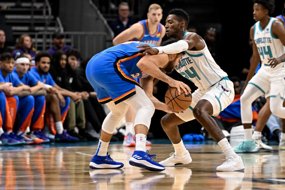 CHARLOTTE, NORTH CAROLINA – OCTOBER 15: Brandon Miller #24 of the Charlotte Hornets defends Vasilije Micic #29 of the Oklahoma City Thunder during the first quarter of the game at Spectrum Center on October 15, 2023 in Charlotte, North Carolina. (Photo by Matt Kelley/Getty Images)