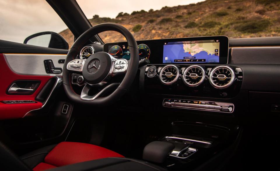 <p>Extensive contrasting trim throughout the interior, ambient lighting that extends across the dash and into the doors, and ornate illuminated vents are all on offer and give the A-class more than enough jewelry to be taken seriously as a luxury car.</p>