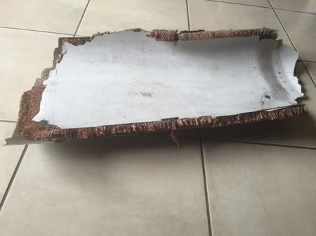 A piece of debris found by a South African family off the Mozambique coast in December 2015, which authorities will examine to see if it is from missing Malaysia Airlines flight MH370, is pictured in this handout photo released to Reuters March 11, 2016. REUTERS/Candace Lotter/Handout via Reuters
