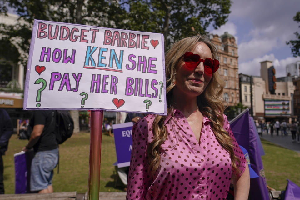 Demonstrators hold placards as they participate in a rally by the UK actors union Equity, in support of the SAG-AFTRA strike on Friday, July 21, 2023, in London. The actors strike comes more than two months after screenwriters began striking in their bid to get better pay and working conditions. (Alberto Pezzali/Invision/AP)