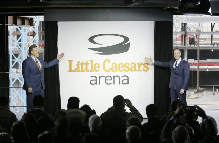 Little Caesars CEO David Scrivano (left) and Detroit Pistons CEO Christopher Ilitch announced the downtown stadium's naming rights in April. (AP)