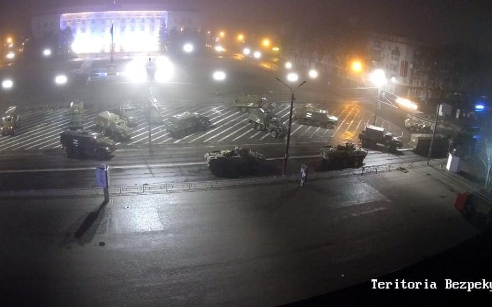 Russian military vehicles arrive in Svobody Square, Kherson, in the early hours of Wednesday