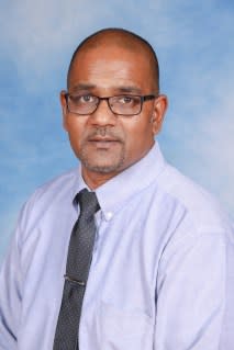 Michael Budhu, a 52-year-old administrator at John Adams High School, allegedly rubbed the inner thigh of the female student. John Adams High School