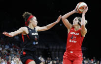 Washington Mystics' Elena Delle Donne shoots against Las Vegas Aces' Dearica Hamby during the second half of Game 4 of a WNBA playoff basketball series Tuesday, Sept. 24, 2019, in Las Vegas. (AP Photo/John Locher)