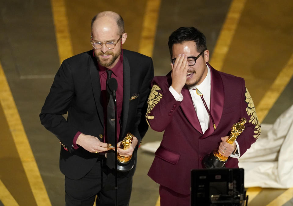 Daniel Scheinert, left, and Daniel Kwan accept the award for best original screenplay for "Everything Everywhere All at Once" at the Oscars on Sunday, March 12, 2023, at the Dolby Theatre in Los Angeles. (AP Photo/Chris Pizzello)