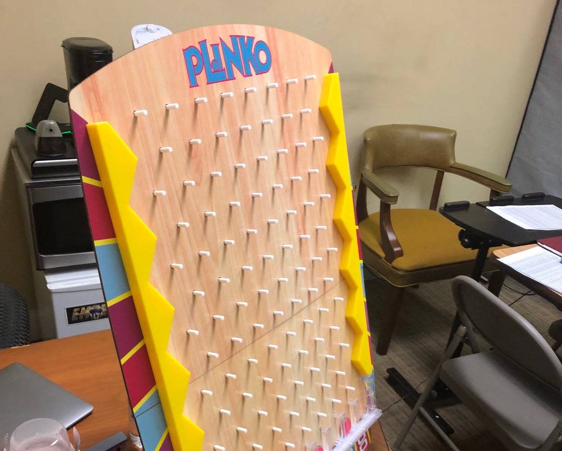 Benedict co-offensive coordinator Kevin Saxton keeps a Plinko board in his office as part of a competition he holds between his quarterbacks. He created a variation of the game he learned working for the Kansas City Chiefs.