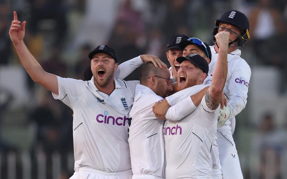 Ollie Robinson, Jack Leach and Ben Stokes of England celebrate winning the First Test Match between Pakistan and England at Rawalpindi Cricket Stadium on December 05, 2022 in Rawalpindi, Pakistan - Matthew Lewis/Getty Images