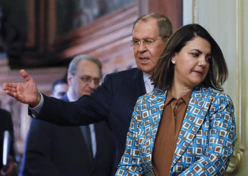 Russian Foreign Minister Sergey Lavrov, welcomes Libyan Foreign Minister Najla Mangoush, foreground, for a joint news conference following their talks in Moscow, Russia, Thursday, Aug. 19, 2021. (Maxim Shipenkov/Pool Photo via AP)