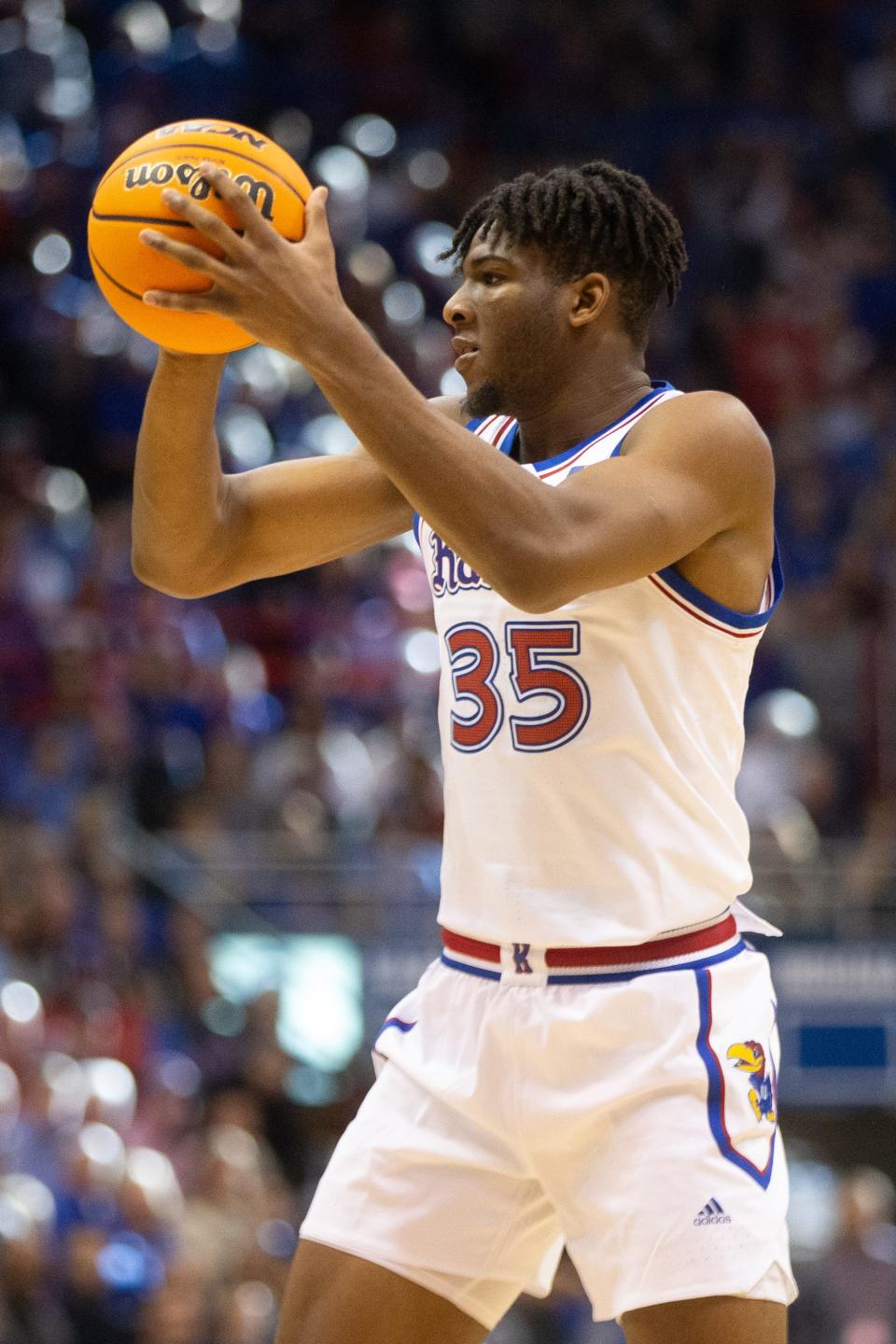 Then with Kansas, Zuby Ejiofor (35) looks to make a play during the second half of a game this past season against Indiana inside Allen Fieldhouse.