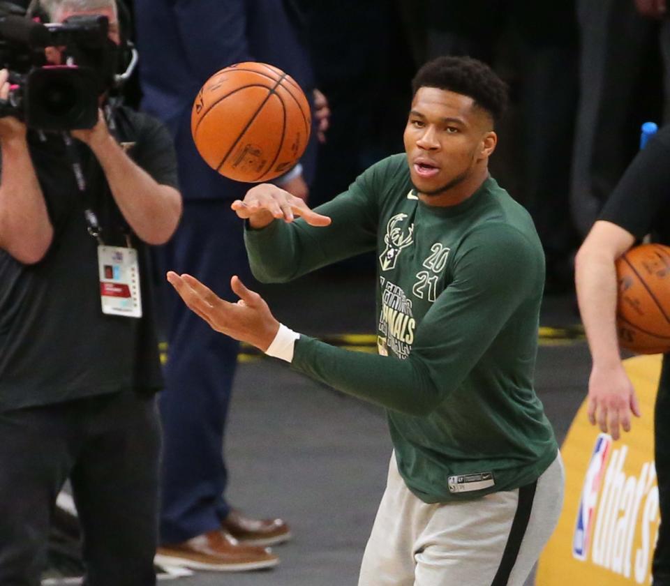 Milwaukee Bucks forward Giannis Antetokounmpo (34) warms up before Game 1 of the NBA Finals against the Phoenix Suns at Phoenix Suns Arena July 6, 2021.