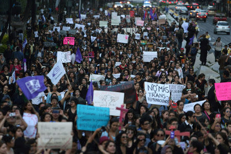 Activists take part in a march to protest violence against women and the murder of a 16-year-old girl in a coastal town of Argentina last week, at Reforma avenue in Mexico City, Mexico, October 19, 2016. REUTERS/Edgard Garrido