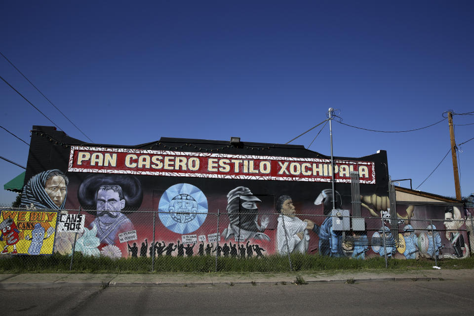 This March 3, 2020 photo shows a mural on the side of a Mexican bakery in downtown Phoenix, Ariz. (AP Photo/Dario Lopez-MIlls)