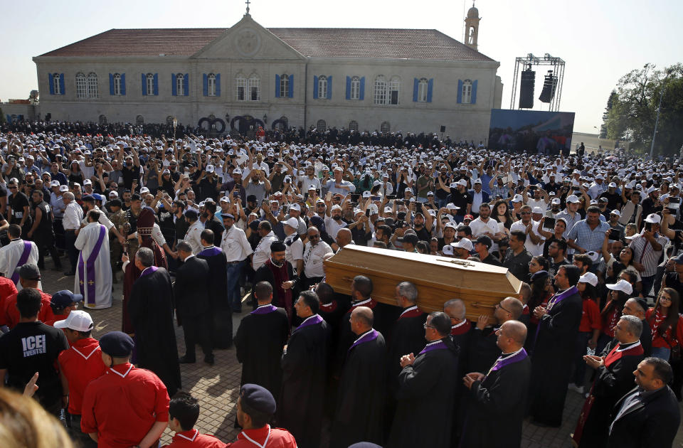 Clergymen carry the coffin of former Maronite Patriarch Cardinal Mar Nasrallah Boutros Sfeir, during his funeral Mass, at the seat of the Maronite Church, in the village of Bkirki, north of Beirut, Lebanon, Thursday, May 16, 2019. Sfeir, who served as spiritual leader of Lebanon's largest Christian community through some of the worst days of the country's 1975-1990 civil war, died Sunday. (AP Photo/Bilal Hussein)
