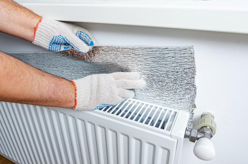 Putting aluminum foil behind radiator