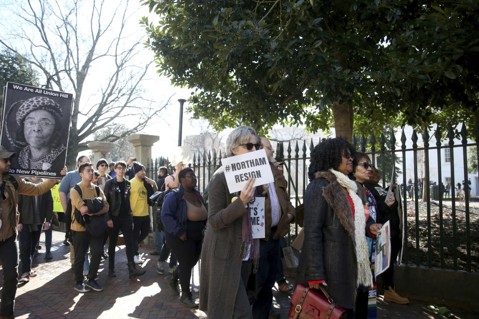 People march near the capitol during a protest in Richmond calling for Virginia Governor Ralph Northam to resign on Monday Feb. 4, 2019. Northam has rebuffed widespread calls for his resignation after a racist photo surfaced Friday in his 1984 medical school yearbook page. (Shelby Lum/Richmond Times-Dispatch via AP)