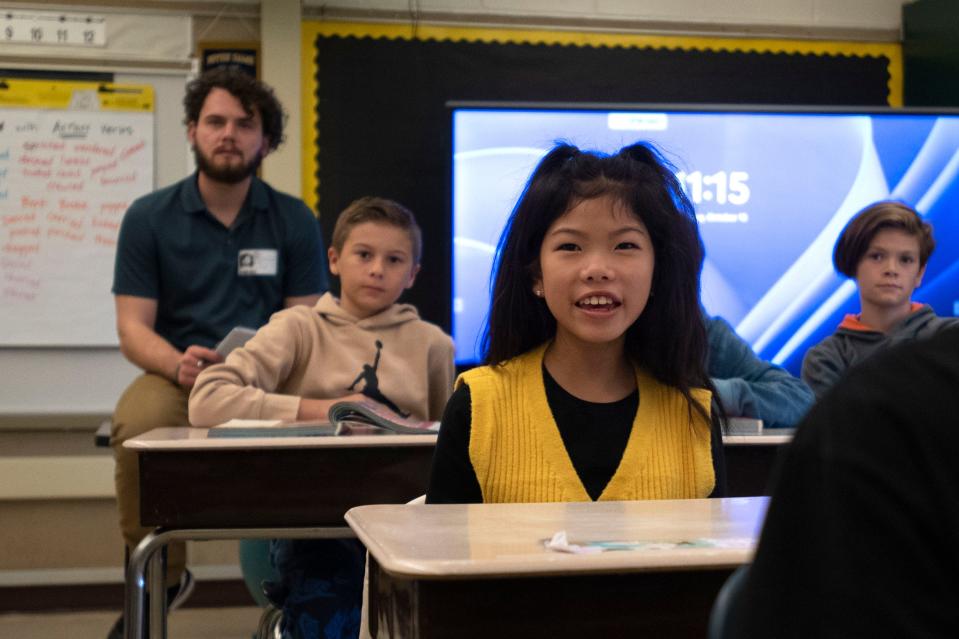 Fifth grade student Hailey Kim comments while Art Goes to School volunteer Jennifer Glatt presents a notable painting at Gayman Elementary School in Doylestown on Tuesday, Oct. 18, 2022.
