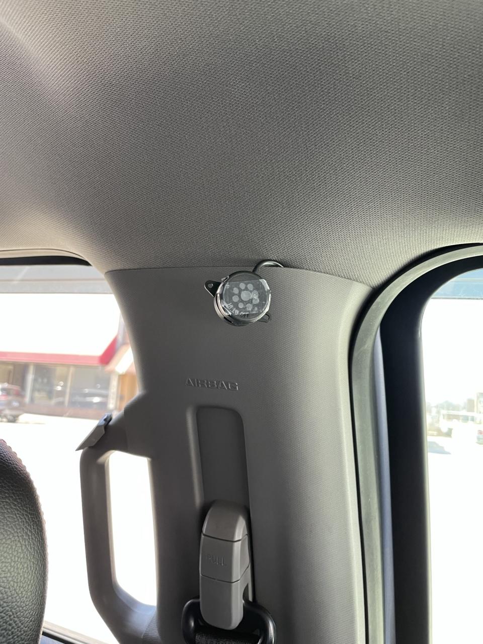 small camera-like object inside a truck