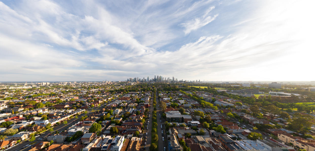 Panoramic aerial of Melbourne CBD skyline.