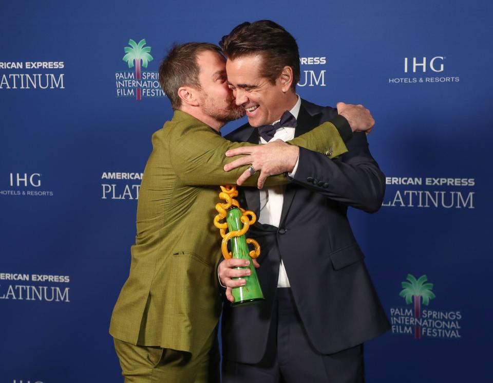 Colin Farrell, right, and Sam Rockwell joke around backstage at the Palm Springs International Film Festival awards gala in Palm Springs, Calif., Jan. 5, 2023.