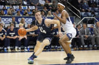 Utah State forward Justin Bean (34) drives as BYU forward Seneca Knight, right, defends in the first half during an NCAA college basketball game Wednesday, Dec. 8, 2021, in Provo, Utah. (AP Photo/Rick Bowmer)