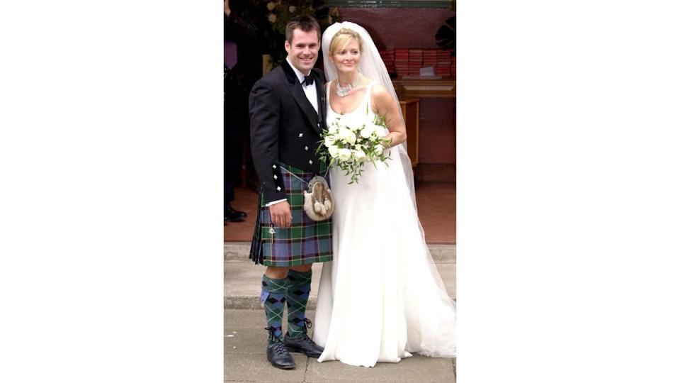 Gabby and Kenny Logan posing for photos on their wedding day