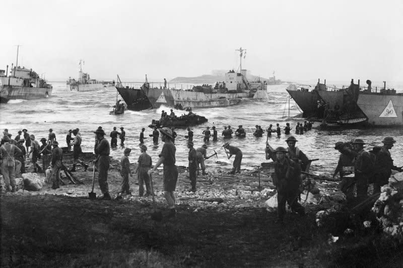 Troops from the 51st Highland Division unload stores from tank landing craft on during the Allied invasion of Sicily, on July 10, 1943. On July 9, 1943, U.S., Canadian and British forces invaded Sicily during World War II. File Photo courtesy of the Royal Navy