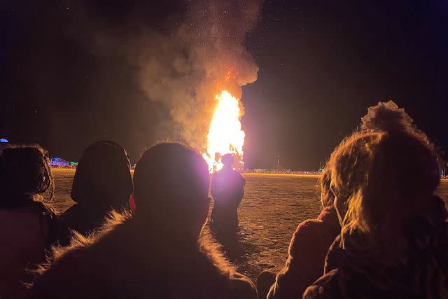 <p>Julie Jammot/AFP via Getty</p> Attendees watching the burning of The Chapel of Babel, an annual event hosted at the Burning Man festival each year