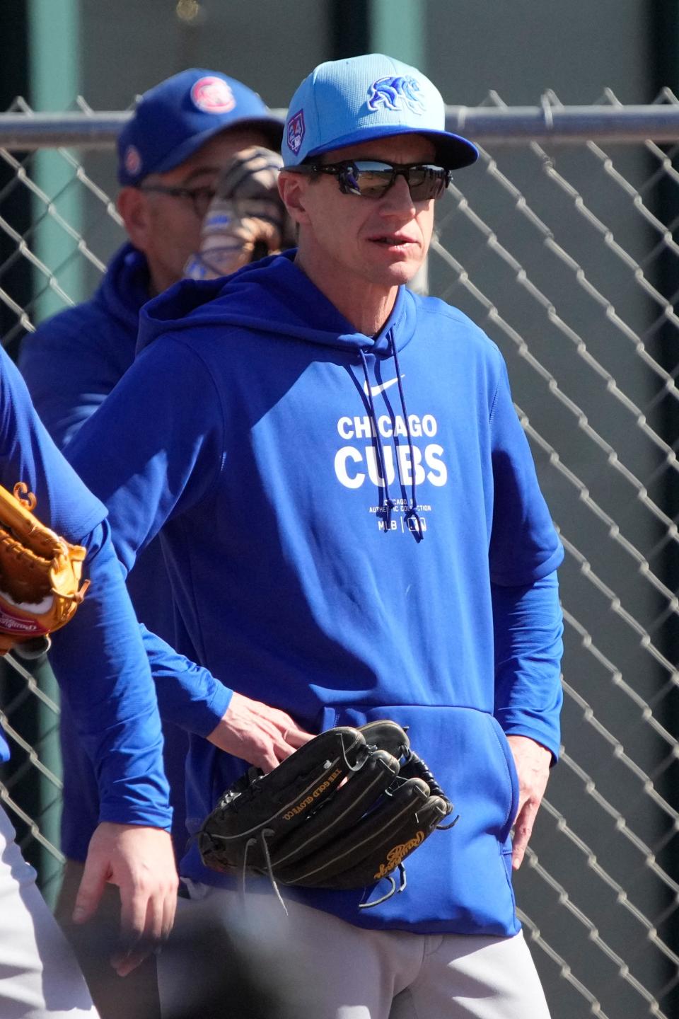 Cubs manager Craig Counsell watches from the bullpen during spring training workouts.