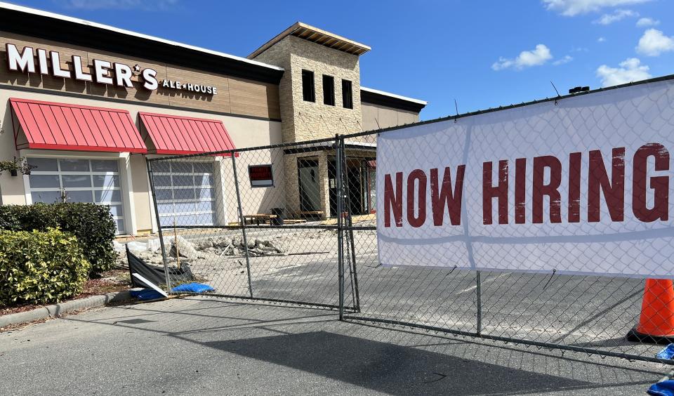 A "Now Hiring" banner can be seen in front of the Miller's Ale House restaurant nearing completion at the Altamira Village shopping center just east of the Interstate 95/Dunlawton Avenue interchange (Exit 256) in Port Orange on Sunday, Oct. 29, 2023. The eatery is on track to open in early December.