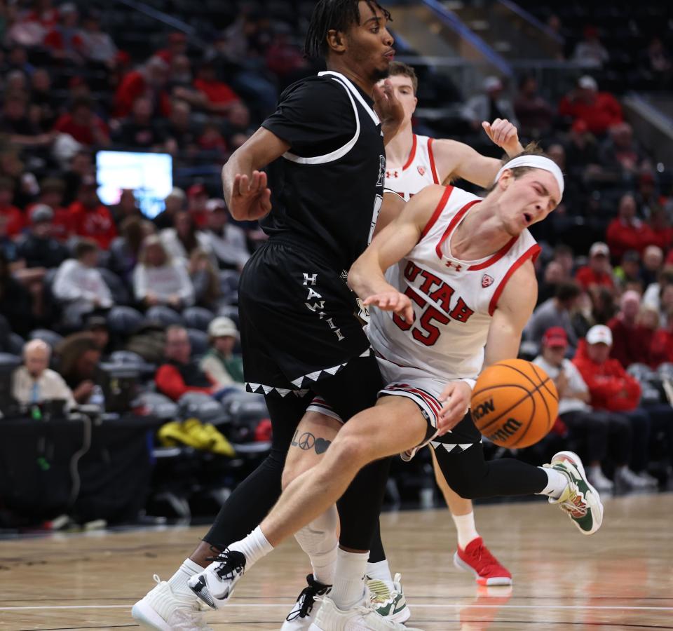 Utah Utes guard Gabe Madsen (55) gets hit in the eye by Hawaii Warriors forward Bernardo da Silva (5) at the Delta Center in Salt Lake City on Thursday, Nov. 30, 2023. Utah won 79-66. | Jeffrey D. Allred, Deseret News