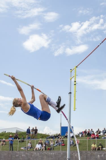 Westlake High's Paige Sommers practices the pole vault before the start of the event at a track meet in 2019.