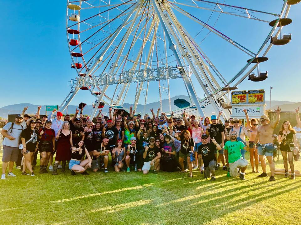 Members of the Facebook community Power Trip Festival Group gather for a group photo at the Ferris wheel during the Power Trip festival at the Empire Polo Club in Indio, Calif., on Oct. 6, 2023.