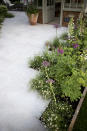 <p> Blending plants and paving can be a tricky business – straight-cut edges can look harsh and formal while no edges at all can be plain messy. So how about this for a stylish compromise? </p> <p> In this garden, pale porcelain paving has been laid on the diagonal with deliberately staggered edges. This jagged arrangement enables the softly planted, billowing borders to spill out onto the stone, blurring the sharp lines and creating a more relaxed yet still elegant look. </p>