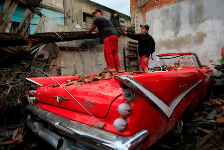 People remove debris after a tornado ripped through a neighbourhood in Havana, Cuba January 28, 2019. REUTERS/Stringer