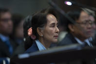 FILE - Myanmar's leader Aung San Suu Kyi waits to address judges of the International Court of Justice on the second day of three days of hearings in The Hague, Netherlands on Dec. 11, 2019. Suu Kyi is the daughter of the country’s independence hero, Gen. Aung San, who was assassinated in 1947, less than six months before the country, then called Burma, became independent from Britain. Suu Kyi moved to New Delhi in 1960 when her mother was appointed ambassador to India and then spent most of her young adult life in the United States and England. Her career in politics began in 1988. (AP Photo/Peter Dejong, File)