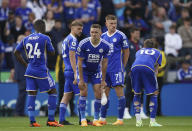 Leicester City players wait to find out the results at other matches after the English Premier League soccer match between Leicester City and West Ham United at King Power Stadium, Leicester, England, Sunday May 28, 2023. (Joe Giddens/PA via AP)