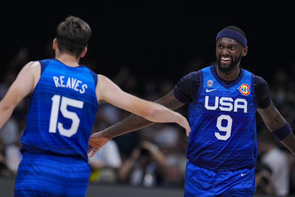 U.S. forward Bobby Portis Jr. (9) celebrates with Austin Reaves (15) during the second half of a Basketball World Cup group C match against Greece in Manila, Philippines Monday, Aug. 28, 2023.(AP Photo/Michael Conroy)