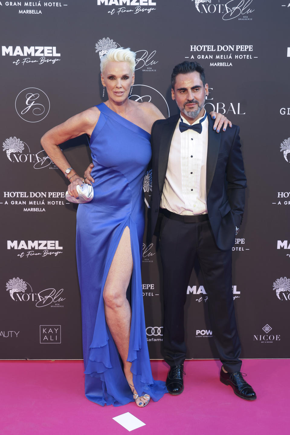 MARBELLA, SPAIN - JULY 24: Brigitte Nielsen and Mattia Dessi attend the Global Gift Gala Red Carpet at Hotel Don Pepe on July 24, 2023 in Marbella, Spain. (Photo by Daniel Perez/Getty Images)