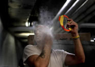 <p>Ringling Bros. boss clown Sandor Eke dusts his face with powder before performing in a show, Friday, May 5, 2017, in Providence, R.I. One of Eke’s earliest memories is of an elephant comforting him, stretching its trunk through his trailer window, while he lay recovering from an illness. Eke’s Hungarian parents were performing at the time at a circus in Sweden, and Eke was just a toddler. A few years later, he’d be a circus performer himself, and aspiring to come to America to join Ringling. (Photo: Julie Jacobson/AP) </p>