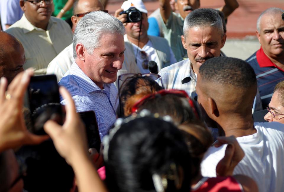 Cuban President Miguel Diaz Canel talks with Caimanera residents in Guantanamo province, Cuba, on November 14, 2019. - Díaz-Canel arrived to Caimanera where the United States maintains a military base, to encourage its citizens to resist the resurgence of the Trump administration's sanctions. (Photo by YAMIL LAGE / AFP) (Photo by YAMIL LAGE/AFP via Getty Images)